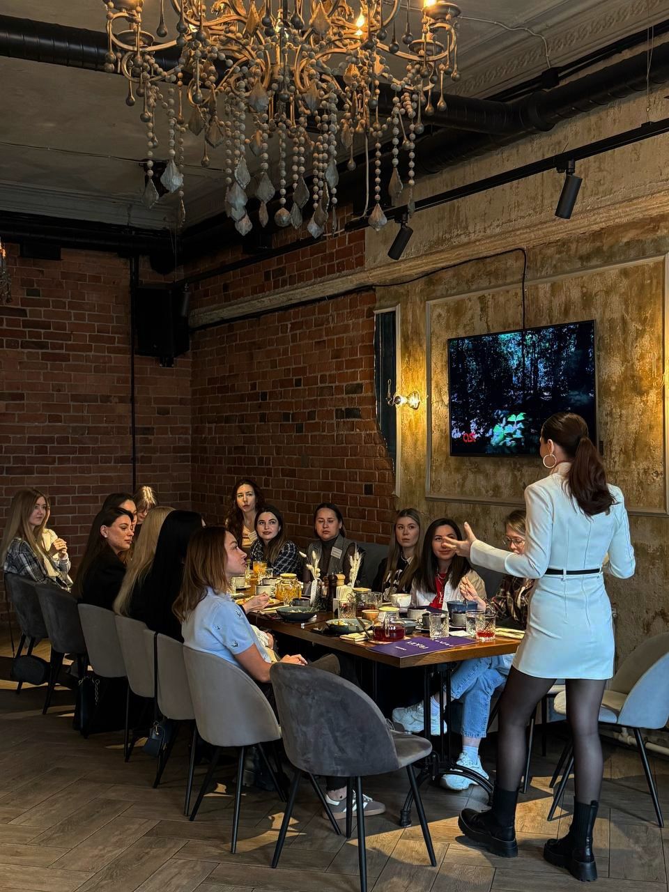 Participants doing light stretching in a bright studio