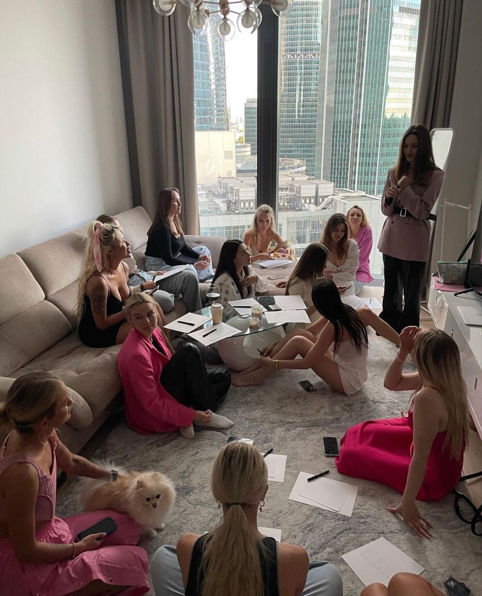 Three people practicing controlled standing stretches