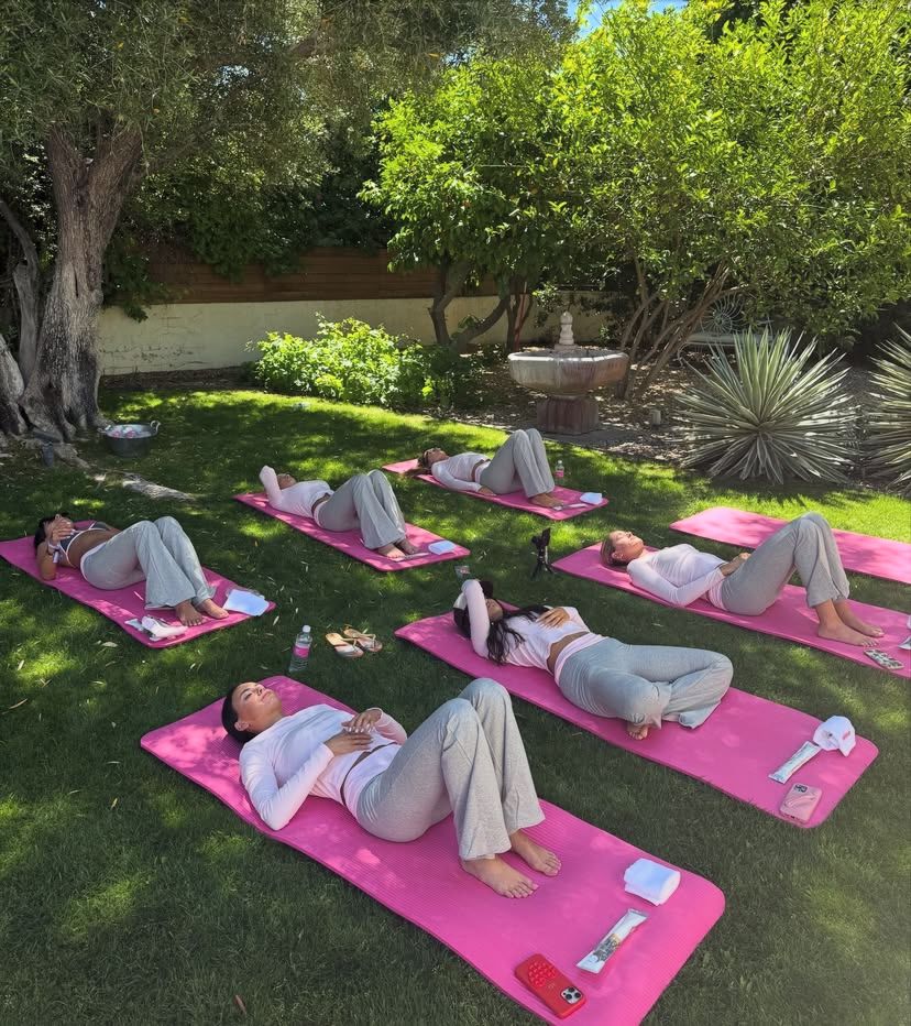 Group in a calm floor stretching sequence